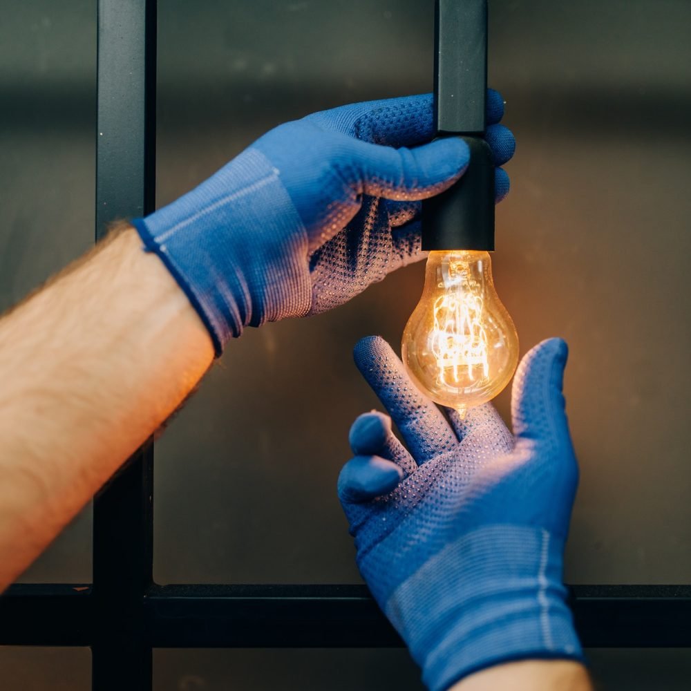 electrician-changes-the-light-bulb-handyman.jpg